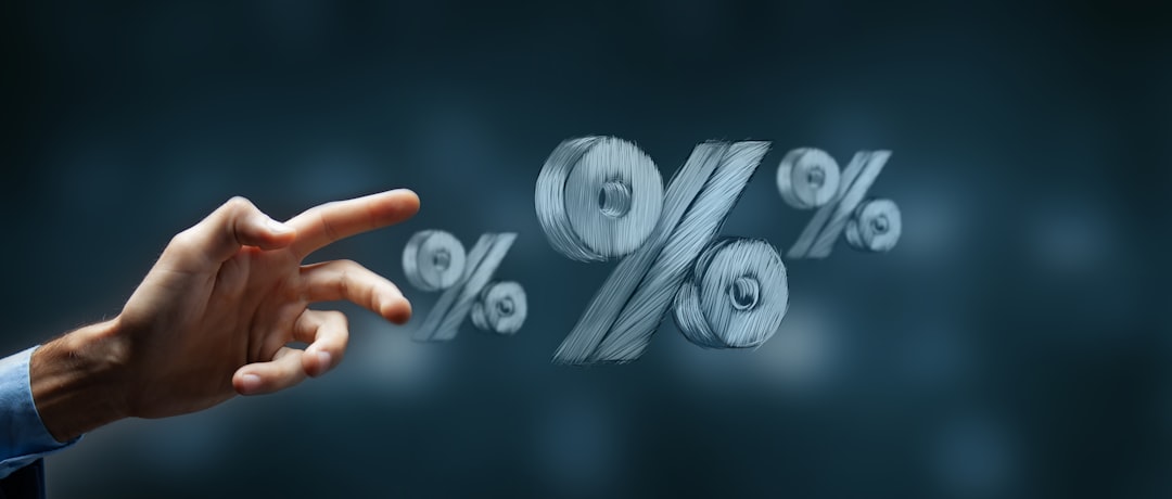 Hand reaching toward hand-drawn percentage symbols
